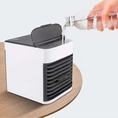 Sheila Merchandise portable air conditioner fan desktop unit with water being poured into the reservoir