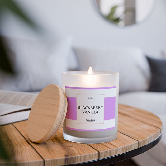Blackberry vanilla candle in a glass jar on a wooden table for a relaxing ambiance