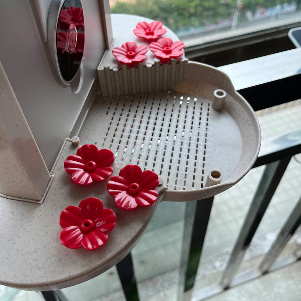 Smart hummingbird feeder with vibrant red flower ports for attracting hummingbirds outdoors