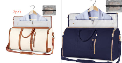 Two stylish travel bags in cream and navy with detachable pouches and adjustable straps