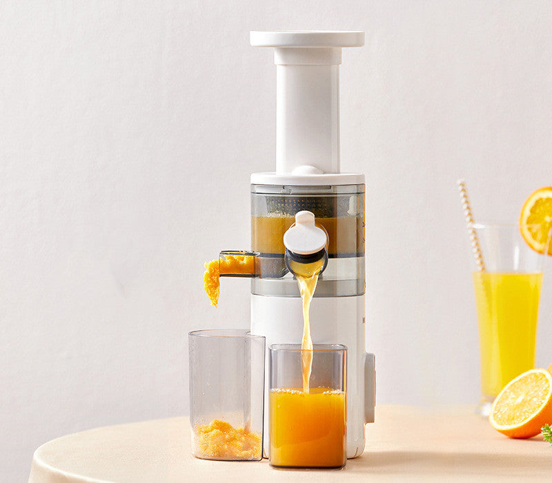 Sheila Merchandise white home juicing machine extracting fresh orange juice into glass on table