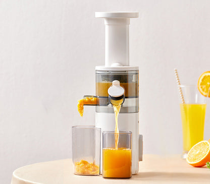 Sheila Merchandise white home juicing machine extracting fresh orange juice into glass on table