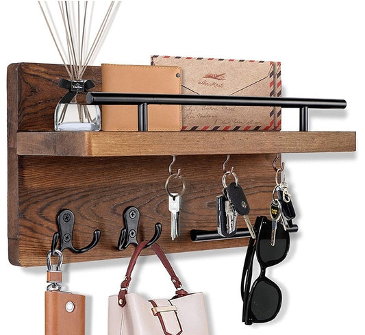 Wall-mounted wooden shelf by Sheila Merchandise with black rail, hooks, and space for keys and accessories